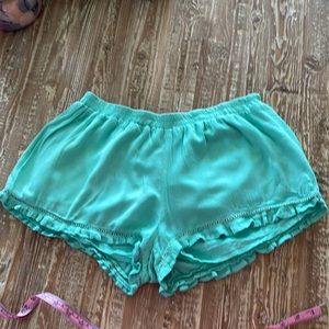 Cute mint green ruffle edged shorts.  Lined, but light and cute